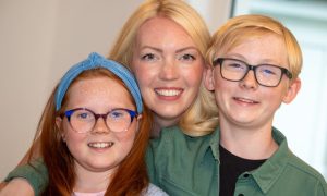 Donna Liddle with children Arianna and Oliver. The children rushed to Donna's rescue when the Aberdeen mum suffered a cardiac arrest at home in June. Image: Kami Thomson/DC Thomson