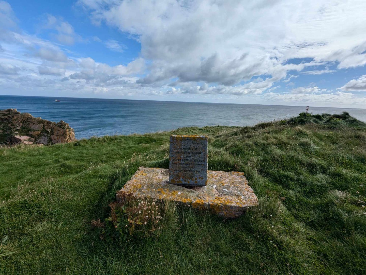 A memorial to two climbers who fell to their death on the cliffs at Longhaven in 1967. Image: Gayle Ritchie.