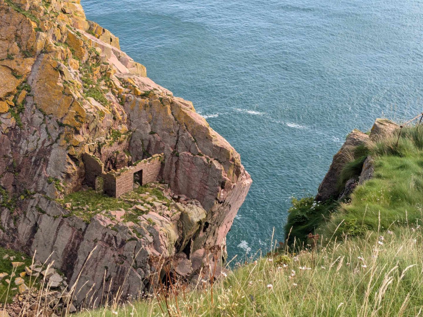 The ruins of the quarry bothy on the cliffs at Longhaven. Image: Gayle Ritchie.