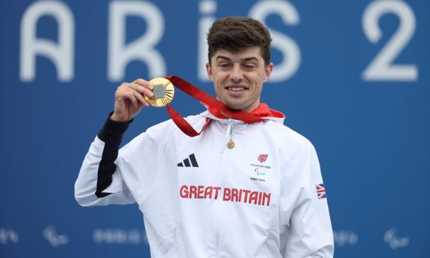 Fin Graham with his Paralympic gold medal from the road race. Image: PA