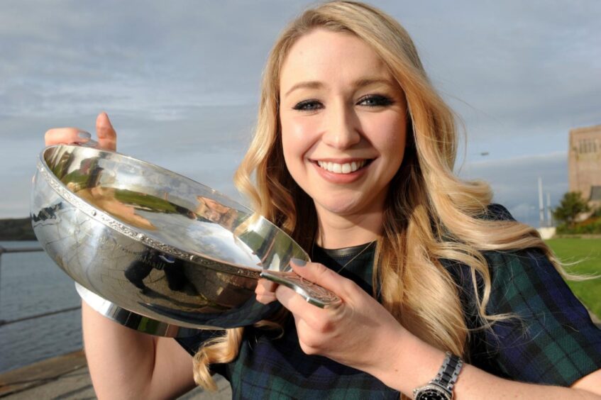 Ainsley Hamill of Cardross with the Mr and Mrs Archibald Macdonald Memorial Trophy for singing.