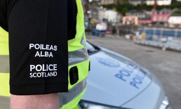 Police uniform and car with an Oban backdrop. A teenager has been charged with drugs offences in Oban.