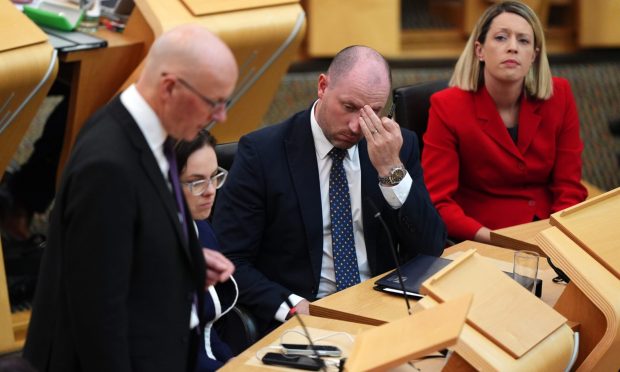 John Swinney was asked if he still has confidence in Neil Gray. Image: PA.