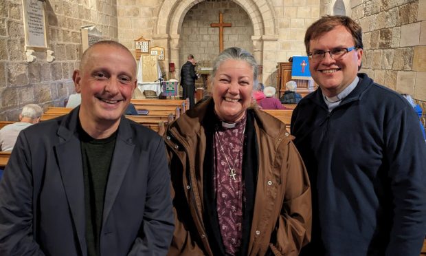 Bryan Miller, Sonia Palmer and Deon Oelofse inside Birnie Kirk.