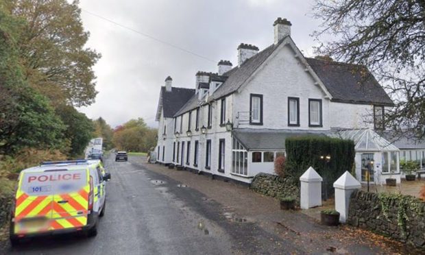 Portsonachan Hotel with a police car outside.