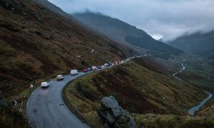 Traffic on a dull and dark day on A83 Rest and be Thankful.