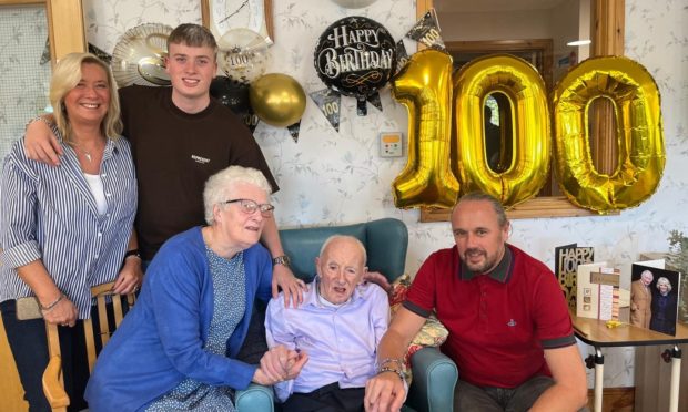 Ronnie Sutherland celebrating his 100th birthday with his family.