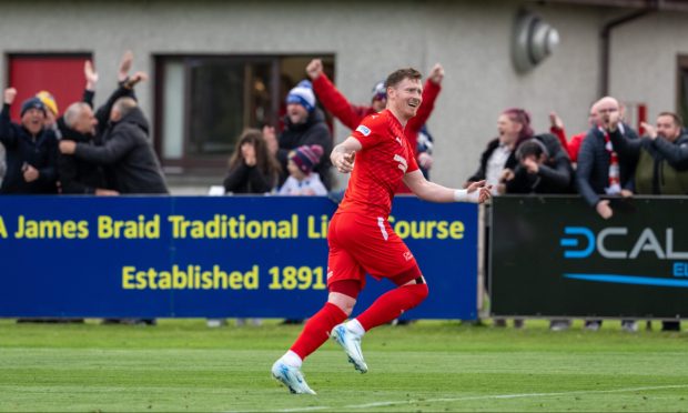 Michael Philipson, centre, celebrates scoring Banks o' Dee's fourth goal in the Evening Express Aberdeenshire Cup win against Aberdeen. Pictures by Darrell Benns/DCT Media.