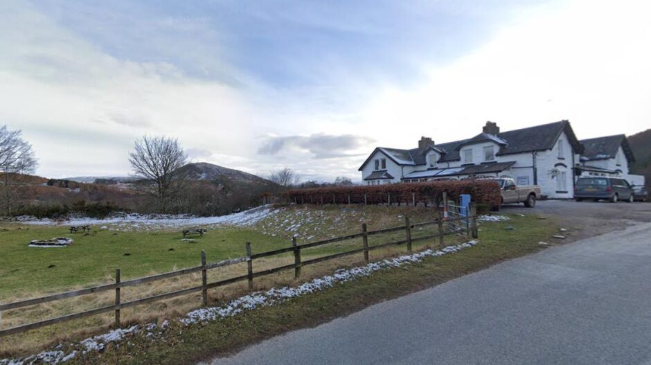 The Whitebridge Hotel overlooking the hills and neighbouring field.