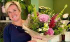 Kirsty Thomson pictured with a bouquet.