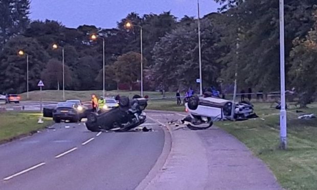 Images from the scene show two cars on their roofs on Barn Church Road. Image: DC Thomson.