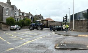 Tractor and car involved in crash on Ellon Road. Image: DC Thomson.