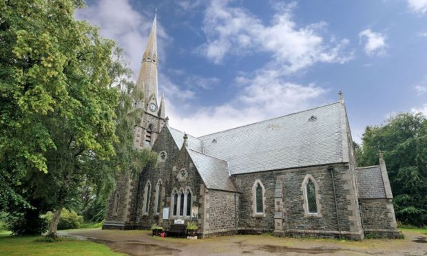 Liam Shand, co-founder of the Highland Paranormal group in the graveyard of the Old High Church in Inverness. Image: Sandy McCook