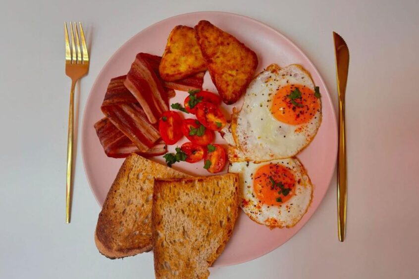 breakfast items on a pink plate for brunch around Aberdeen.