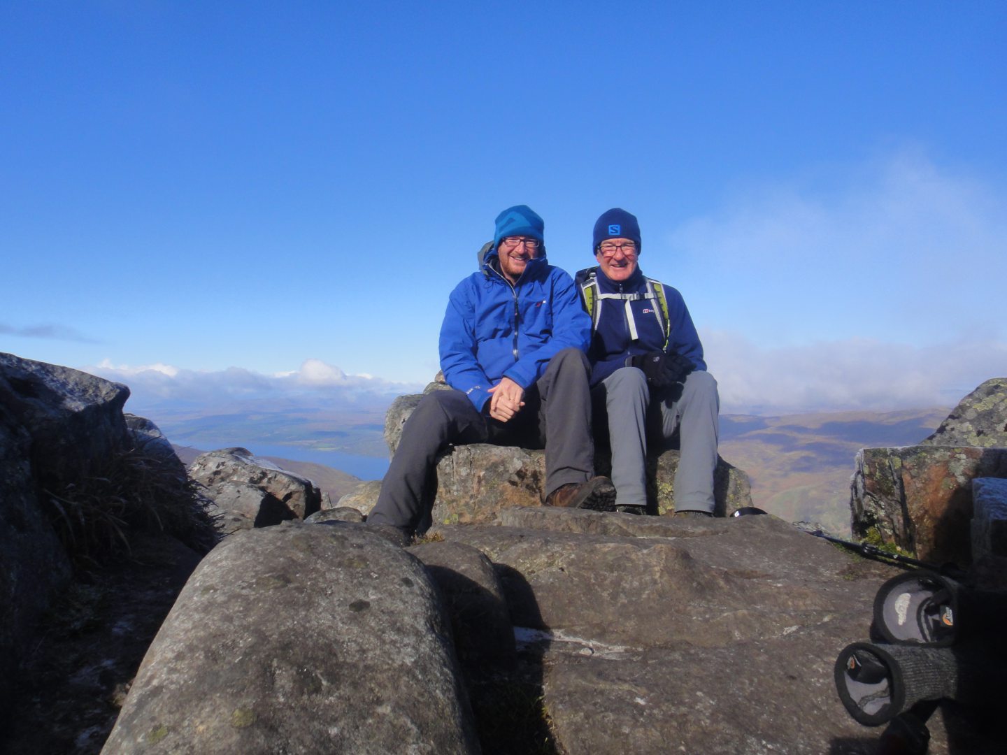 Mitch and his son Ian with a blue sky behind them