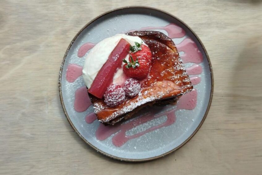 pudding on a blue plate. for brunch around Aberdeen.