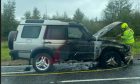 firefighter extinguish car fire on A96