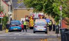 Police and firefighters on residential Street in Inverness.