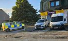 Police at the scene of the horrific crash on the A90 near Ellon. Image: Newsline Media