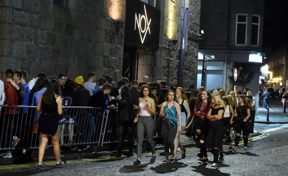 Students queuing to get in to Nox in Aberdeen during freshers' week in 2017