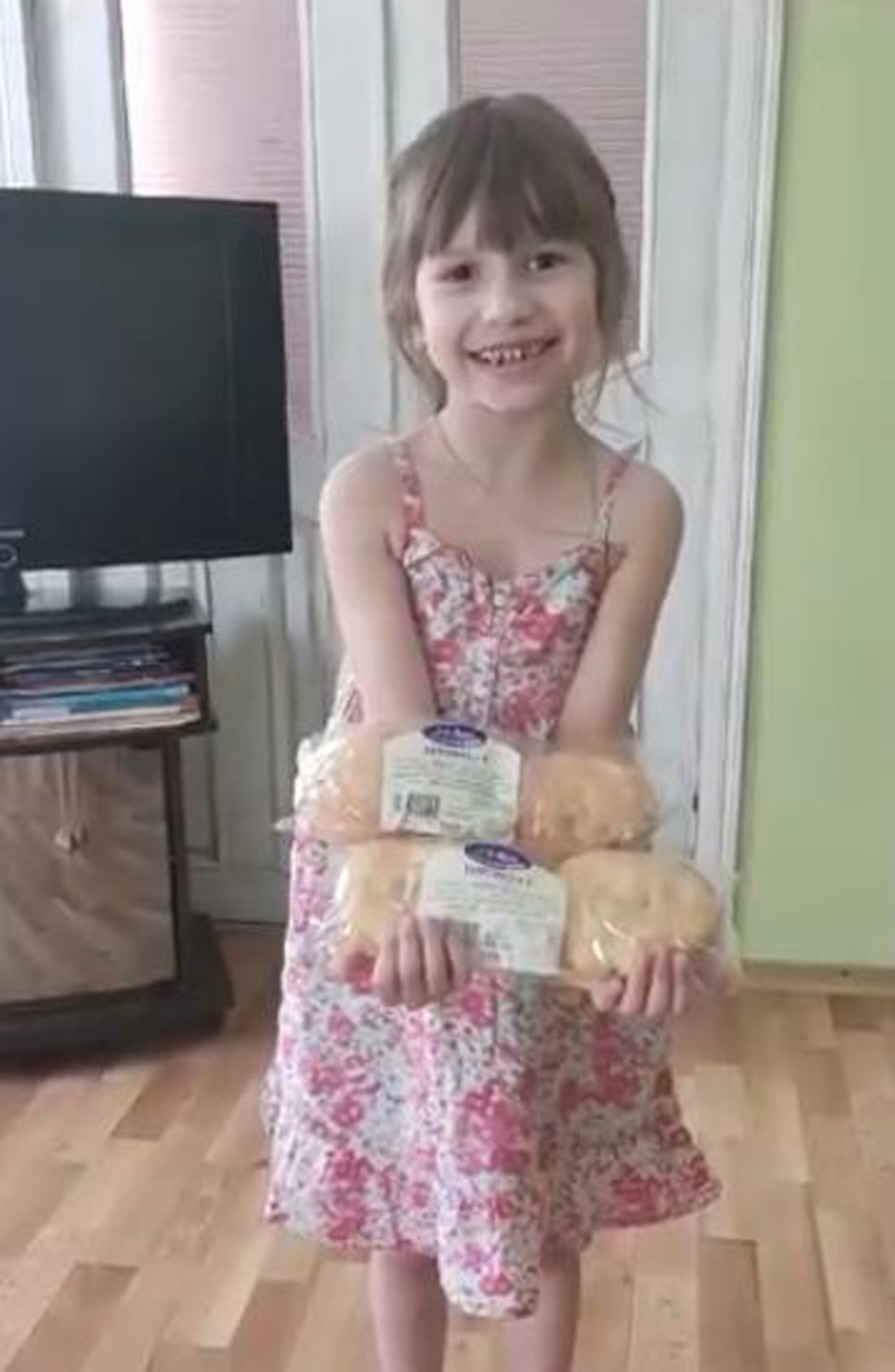 Young girl holding butteries