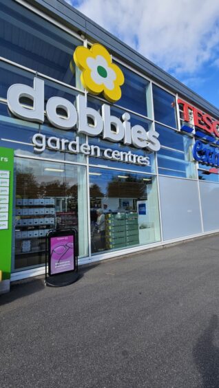 Dobbies sign next to Tesco sign.