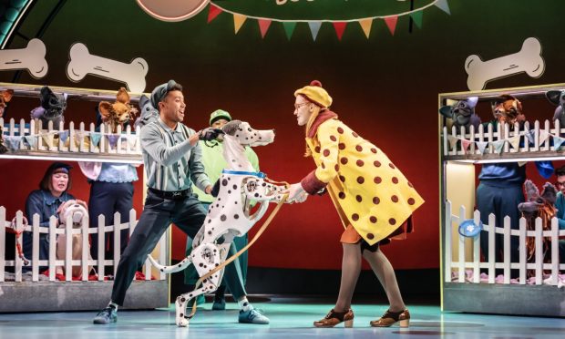 Character Danielle, right, meeting Pongo - played by Linford Johnston - for the first time. Image by Johan Persson.