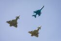 A Romanian Air Force MiG 21, Royal Air Force Typhoon and German Luftwaffe Eurofighter during a military exercise. Image: RAF Lossiemouth