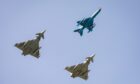 A Romanian Air Force MiG 21, Royal Air Force Typhoon and German Luftwaffe Eurofighter during a military exercise. Image: RAF Lossiemouth