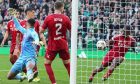 Aberdeen's Duk blocks a shot from Alistair Johnston of Celtic in the dying seconds of 10 minutes of time added on after 90 minutes. Image: Shutterstock.