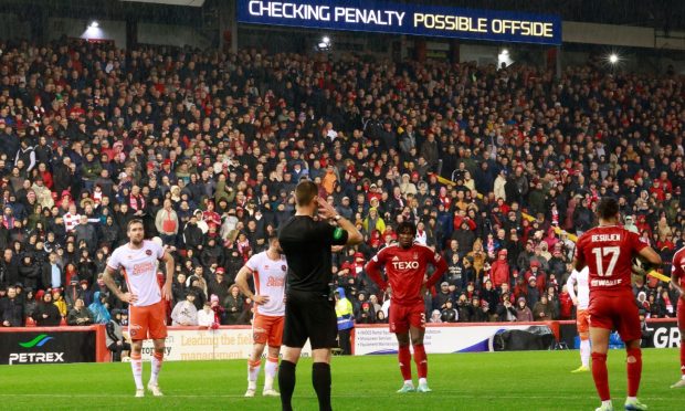 Referee Steven McLean gives offside after a VAR check during Dundee United v Aberdeen. Image: Shutterstock.