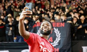 Shayden Morris (20) of Aberdeen takes a selfie with the Aberdeen fans after the 1-0 win against Dundee United at Pittodrie. Image: Shutterstock