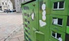 Look closely and you'll see a tiny window cleaner at work on an existing piece of Aberdeen artwork that looks like a block of flats. Image: MicroMischief.