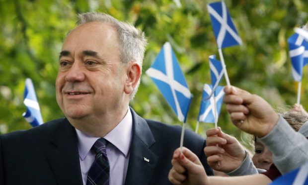 First Minister of Scotland Alex Salmond chats to school children at Strichen Primary School in Strichen, as polls have opened on a historic day for Scotland as voters determine whether the country should remain part of the United Kingdom.