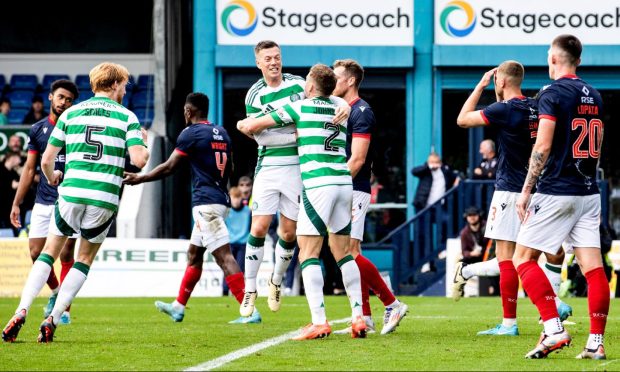 Celtic's Alistair Johnston (number two) celebrates with Callum McGregor after scoring to make it 1-1  at Dingwall in October. Celtic scored late on for a 2-1 win. Image: SNS.