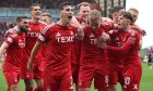 Aberdeen's Jamie McGrath celebrates after Topi Keskinen (second right) scores in the 3-2 win against Hearts. Image: SNS