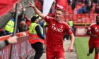 Aberdeen's Ante Palaversa celebrates in front of home fans i the South Stand at Pittodrie after scoring to make it 3-2 against Hearts.