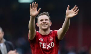 ABERDEEN, SCOTLAND - OCTOBER 06: Aberdeen's Nicky Devlin celebrates at full time during a William Hill Premiership match between Aberdeen and Heart of Midlothian at Pittodrie, on October 06, 2024, in Aberdeen, Scotland. (Photo by Mark Scates / SNS Group)