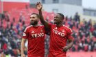 Aberdeen attacker Luis Lopes (R) and Graeme Shinnie celebrate at full time after the 3-2 win against Hearts at Pittodrie. Image: SNS