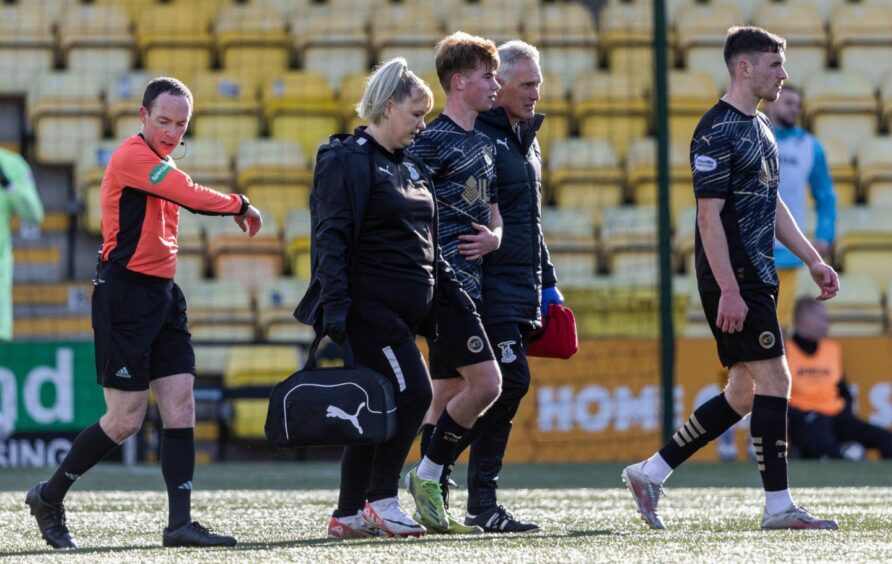 Inverness midfielder Keith Bray goes off injured at Livingston.