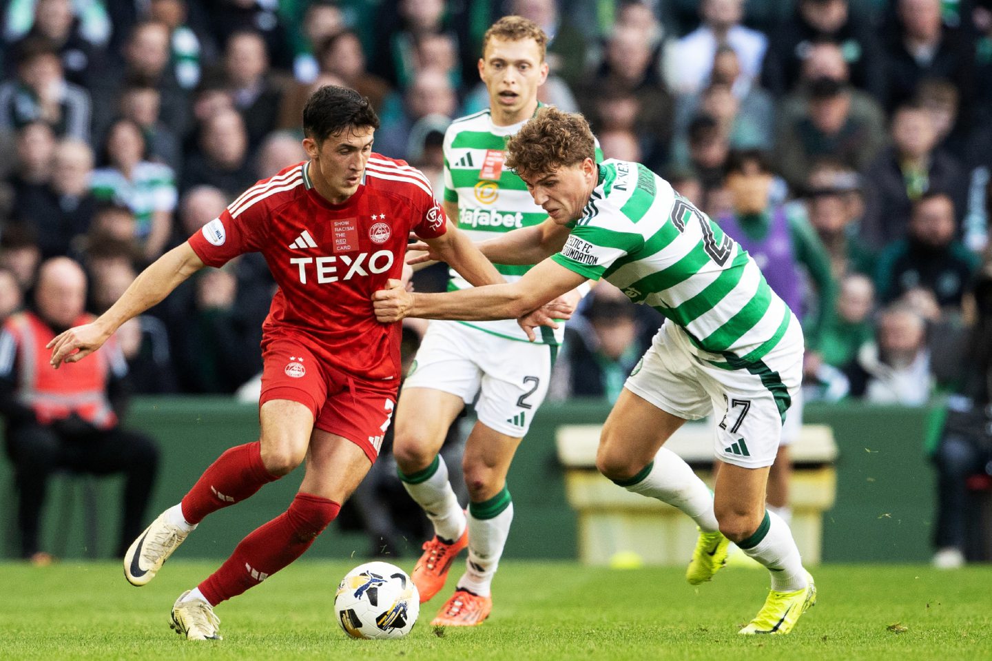 Aberdeen's Jamie McGrath and Celtic's Arne Engels in action during the 2-2 draw at Parkhead. Image; SNS