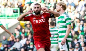 Aberdeen's Graeme Shinnie celebrates after scoring to make it 2-2 against Celtic at Parkhead. Image: SNS