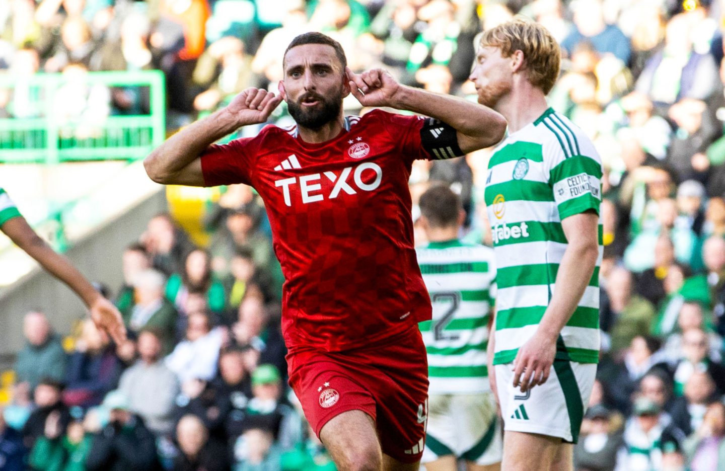 Aberdeen's Graeme Shinnie celebrates after scoring to make it 2-2 against Celtic at Parkhead. Image: SNS 