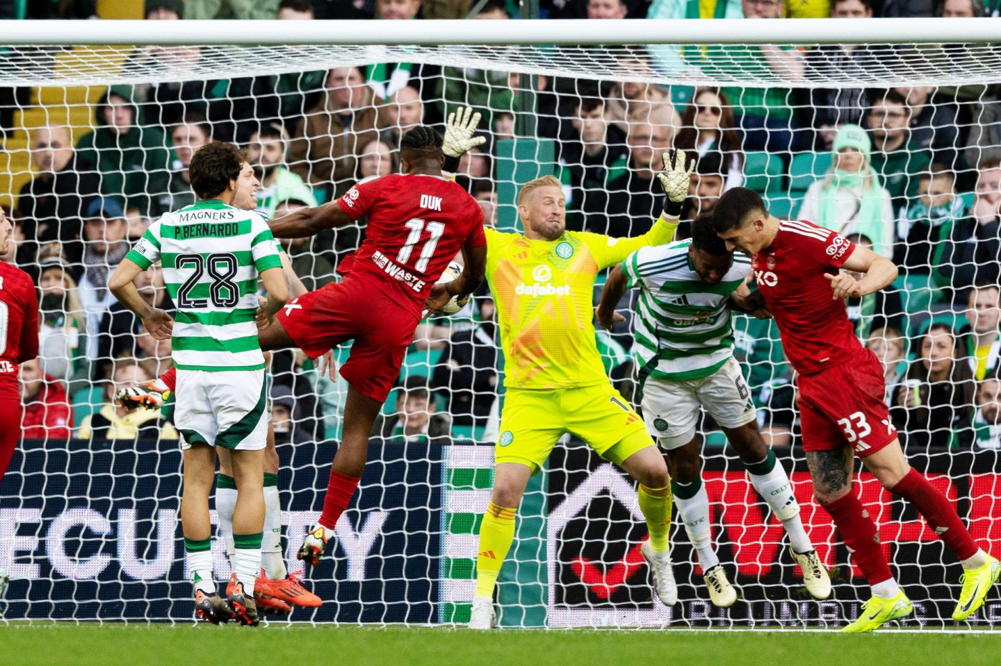 Aberdeen take the lead through Duk but the goal is ruled out for a handball in the 2-2 draw at Celtic. Image; SNS 