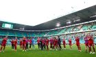 The Aberdeen players with their fans at full-time after drawing at Celtic. Image: SNS.