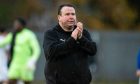 Inverness Caledonian Thistle head coach Scott Kellacher applauds his supporters after a recent League One match.