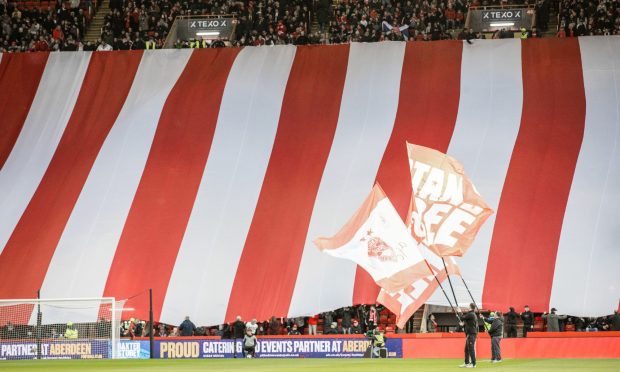 Aberdeen fans display during a Premiership match against Dundee United at Pittodrie.