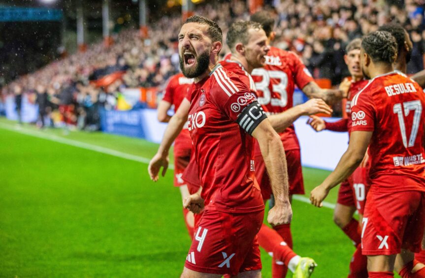 Aberdeen's Graeme Shinnie celebrates after Peter Ambrose scores to make it 1-0 against Dundee United. Image: SNS