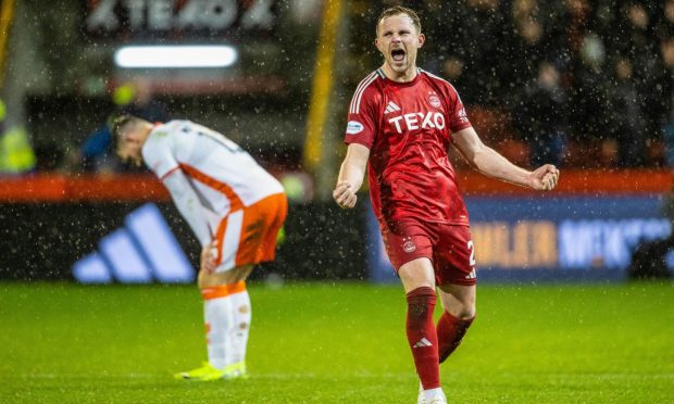 Aberdeen's Nicky Devlin celebrates at full time after the win against Dundee United. Image: SNS.