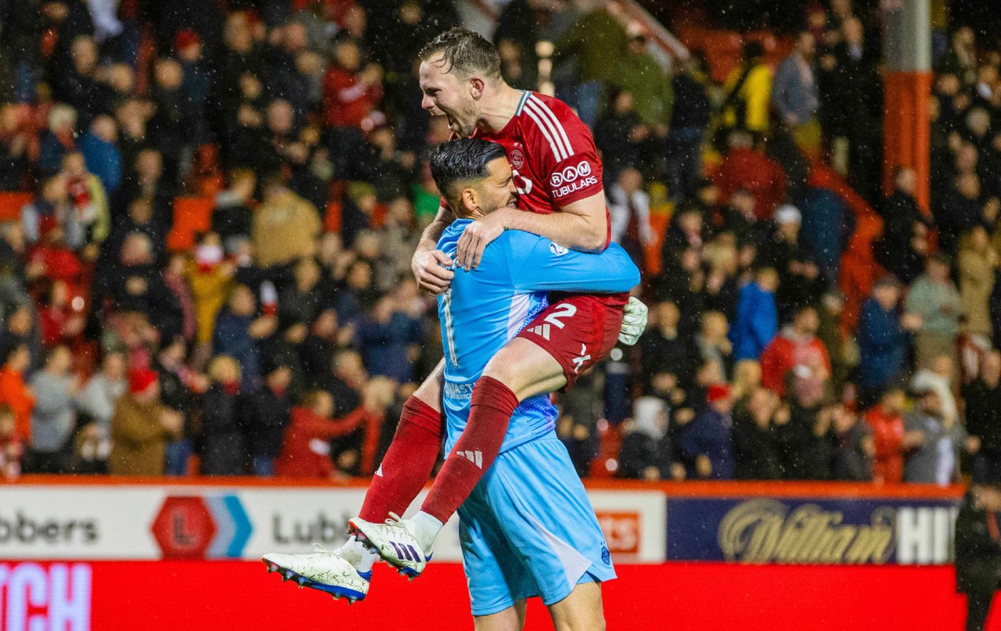  Aberdeen's Nicky Devlin and Dimitar Mitov celebrate during the 1-0 win against Dundee United. Image; SNS 